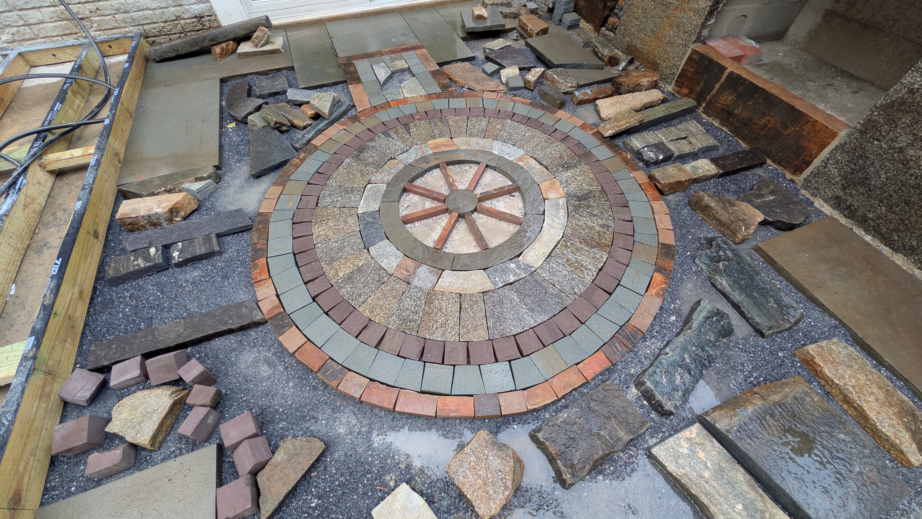 WildWorks - Stone staircase and pathway leading to a rustic house with natural landscaping