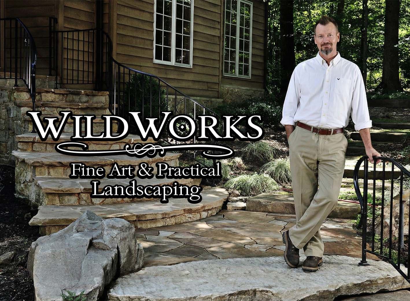 WildWorks - Stone staircase and pathway leading to a rustic house with natural landscaping